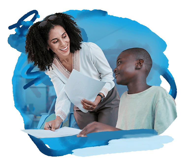 teacher working with a student on homework