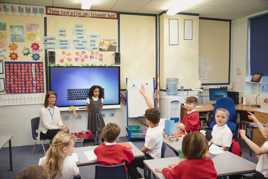 Presenting to the Class with her Teacher